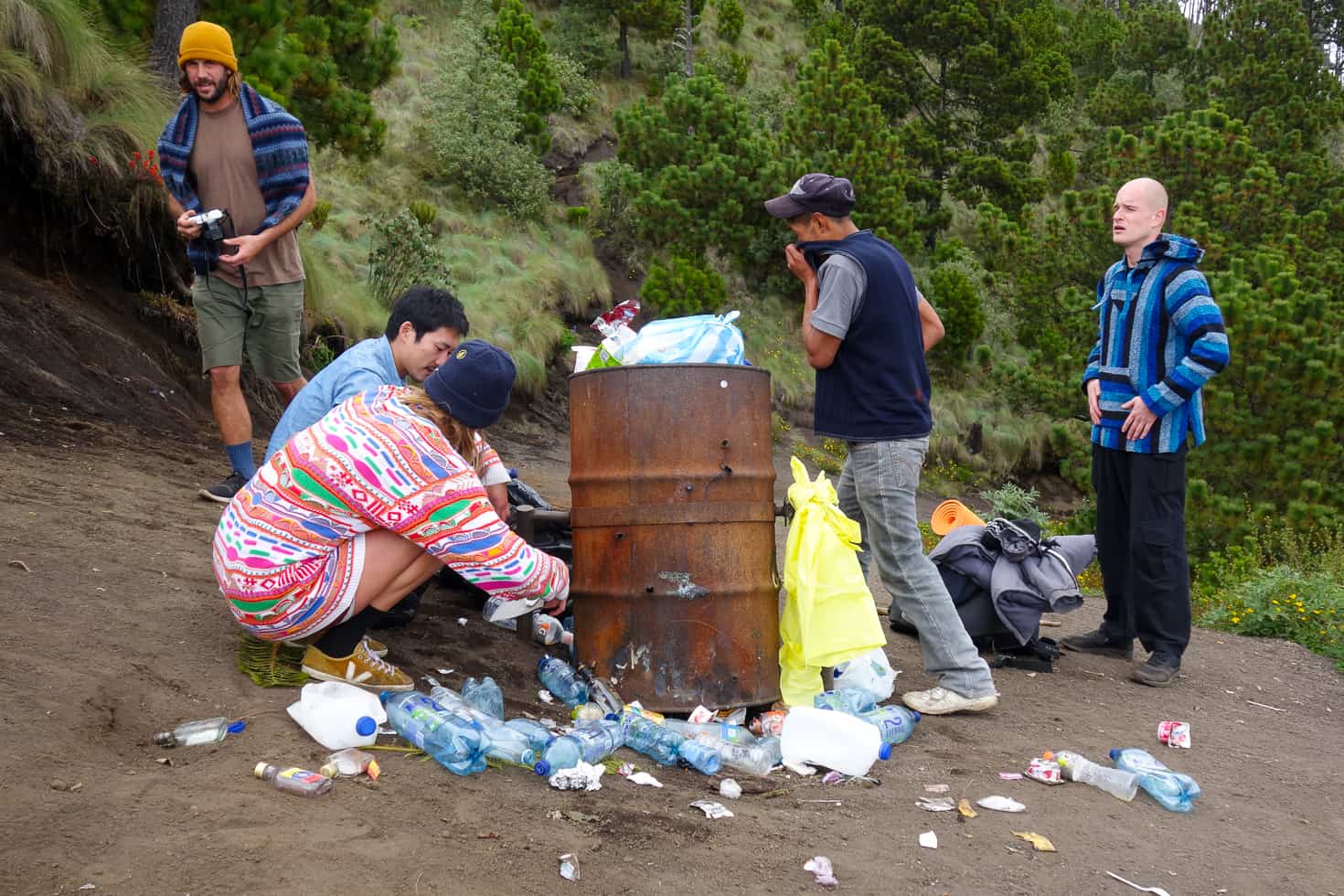 Clearing up the garbage left by other guides at Acatenango Volcano